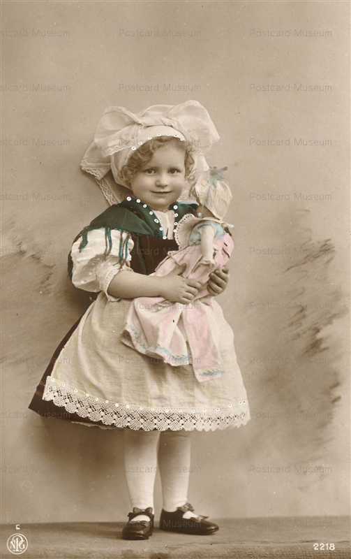 do165-Girl Holds Doll