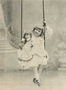 dob060-Cute Edwardian Girl with Big Doll on Swing