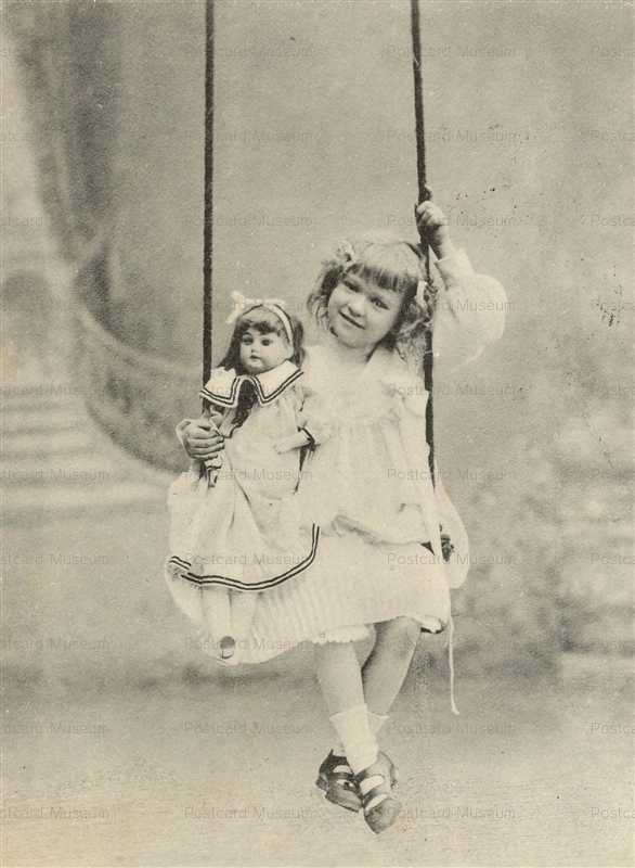 dob060-Cute Edwardian Girl with Big Doll on Swing