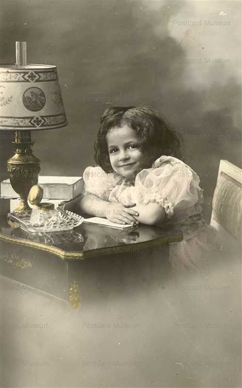 eg034-Cute Girl Sitting at a Desk