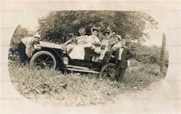 car090-Couples Taking Trip in Early Automobile